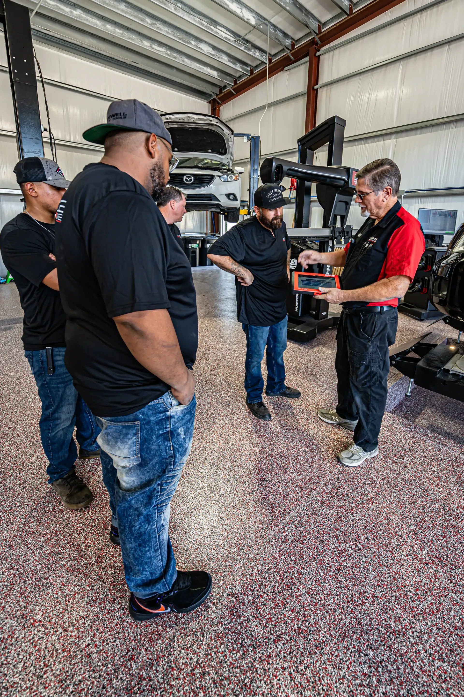 Advance Automotive technicians working on a vehicle